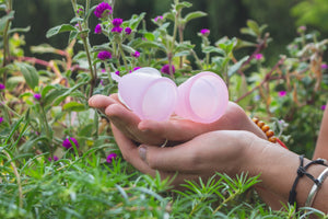 Pink Menstrual Cups holded in the hands on thegarden -  In Stock in Pasig City, Metro Manila, Philippines - Eco Shop PH - Zero Waste Philippines